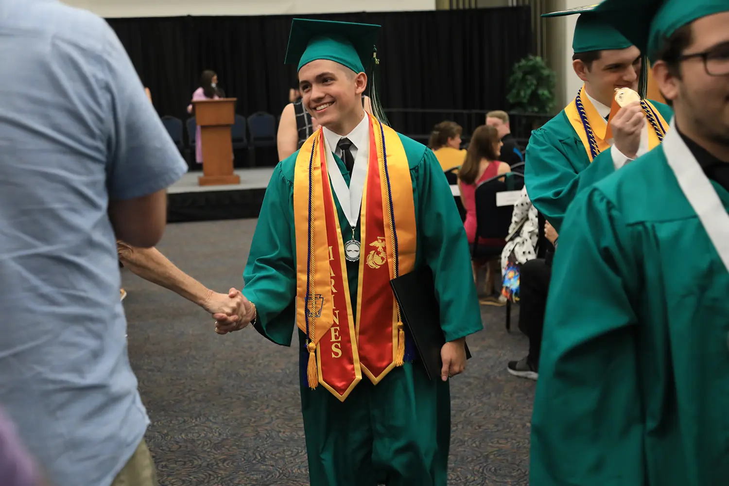 Graduate Student Shake Hands | Greenwood School